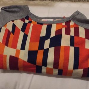 A Lularoe women’s shirt and Lularoe leggings set.